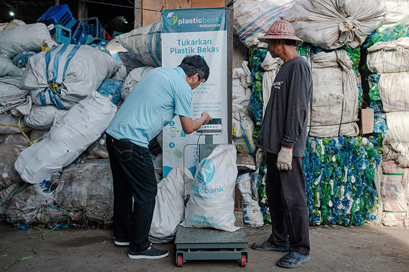 Plastic Bank collection member exchanging plastic waste at a collection branch