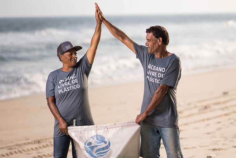 Plastic Bank collection members in Brazil collecting plastic by the ocean.