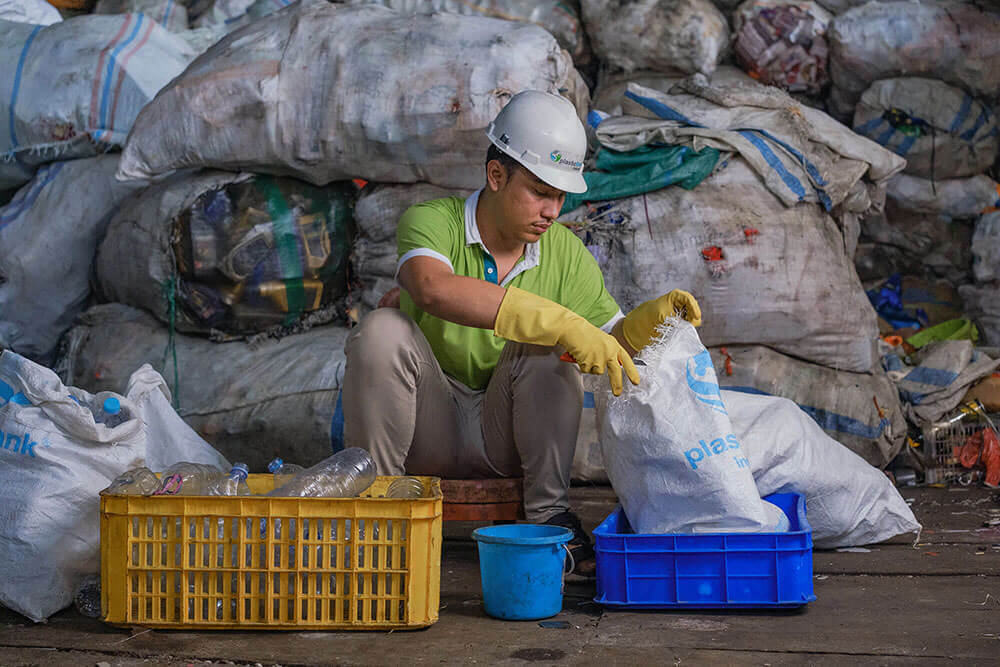 counting bottles at a Plastic Bank recycling location